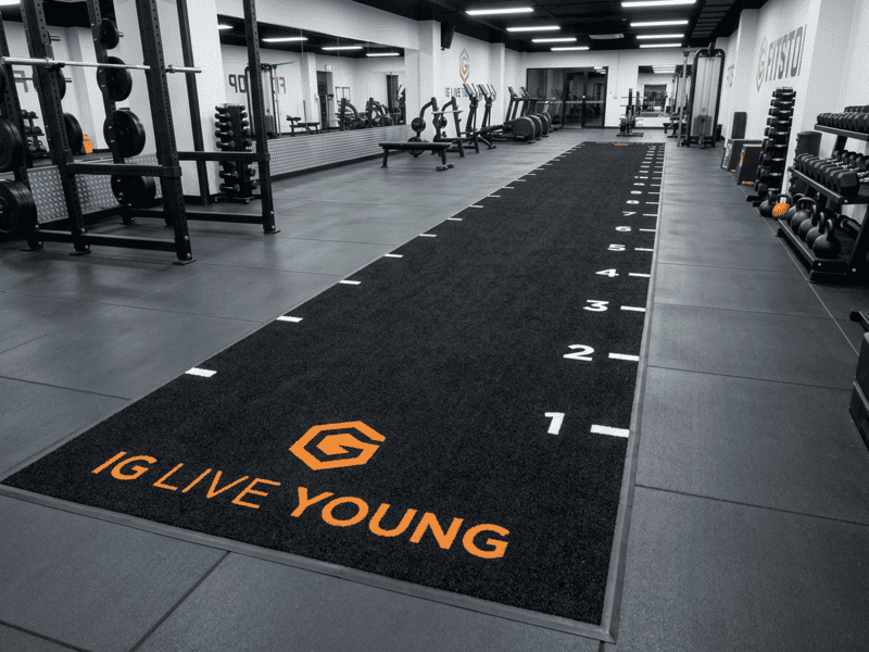 Quality control specialist testing gym turf for static resistivity